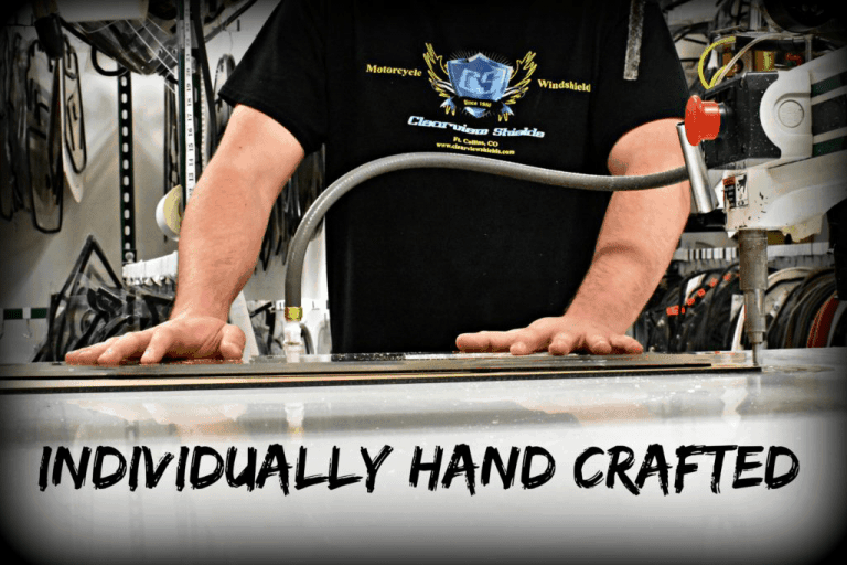 CRAFTING A CLEARVIEW 2 MOTORYCYCLE PARTS IN BACKGROUND; TORSO PICTURES WITH HANDS SPEAD ON A TABLE
