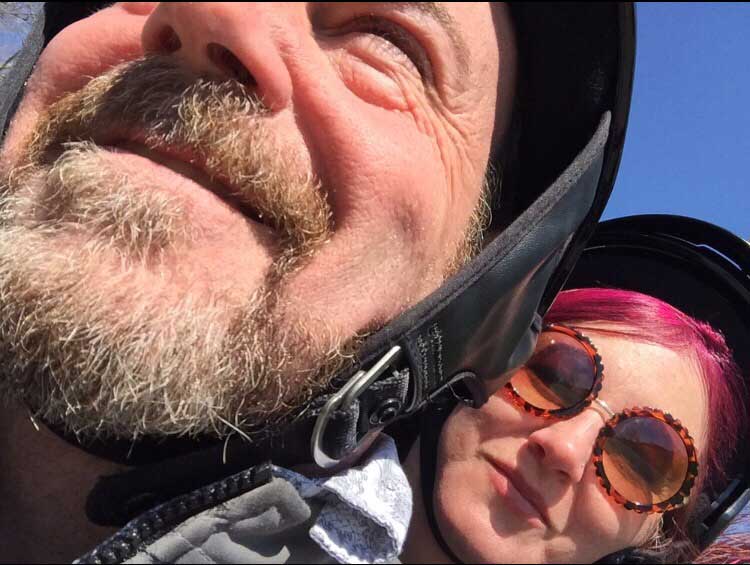 7 Ways to Save Money On Your Motorcycle Insurance 9 couple riding their harley davidson street glide motorcycle