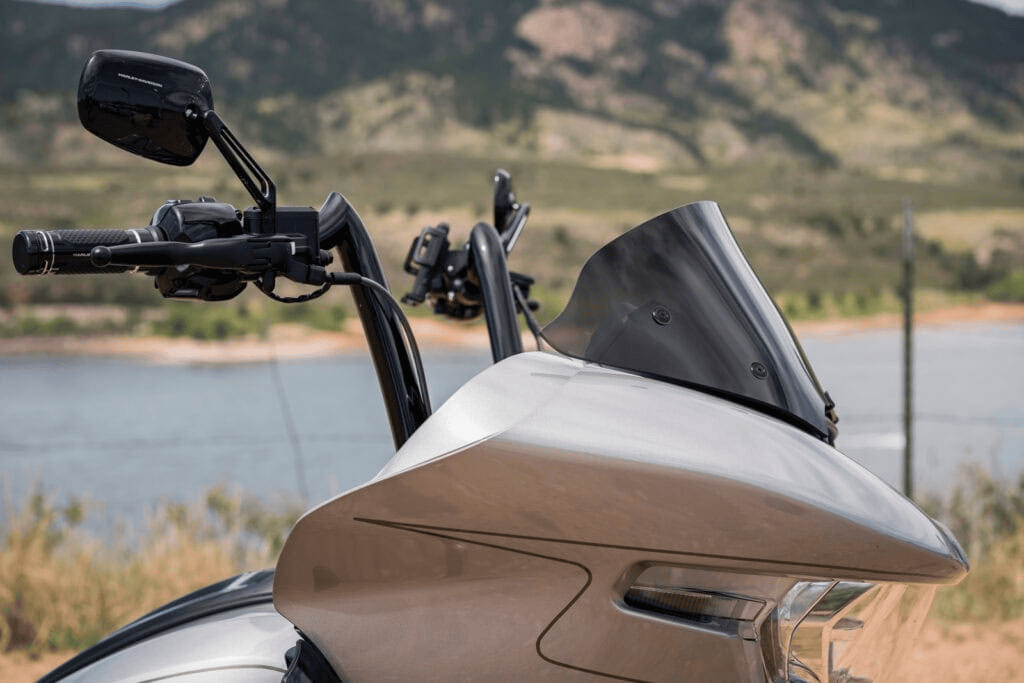 Choosing Your Shield 16 Harley-Davidson Road Glide with a tinted Clearview windshield overlooking a mountain lake